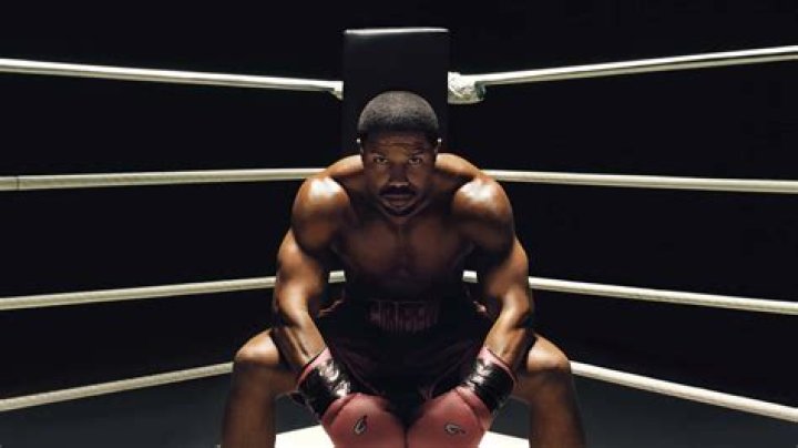 Adonis is in a boxing ring ready to throw a punch in Creed III.